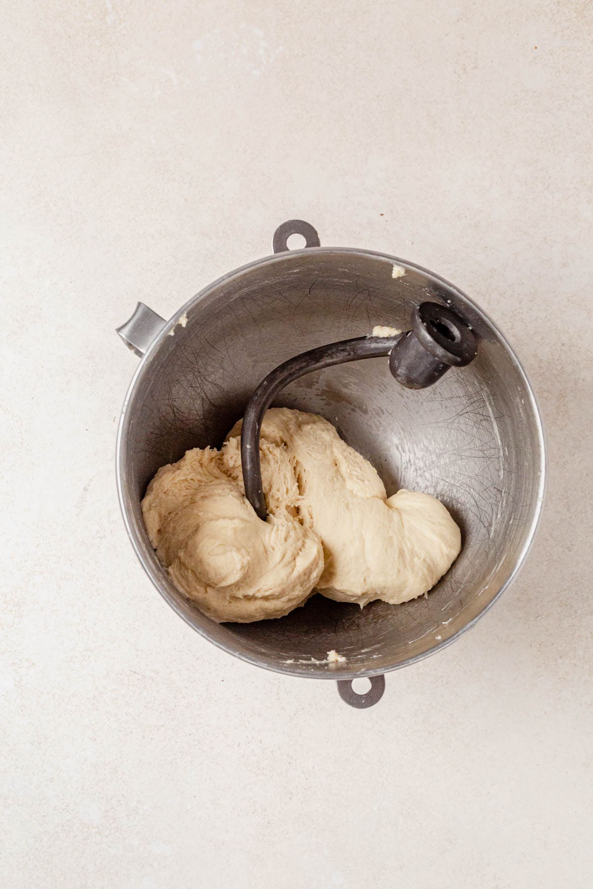 kneading cottage cheese dinner roll dough in a stand mixer.