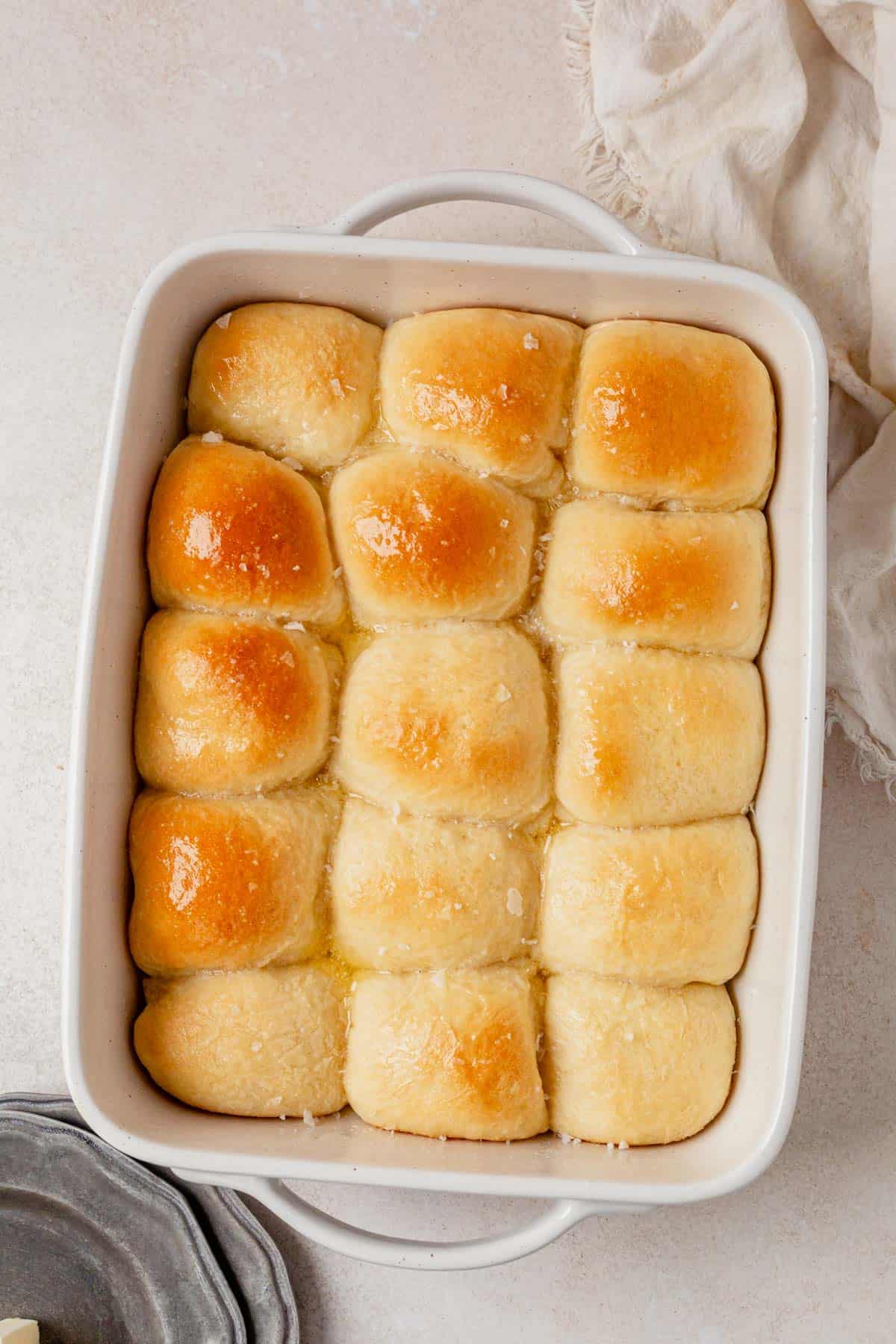 fresh baked cottage cheese dinner rolls cooling in a pan.