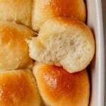 a cottage cheese dinner roll being pulled out of the pan.