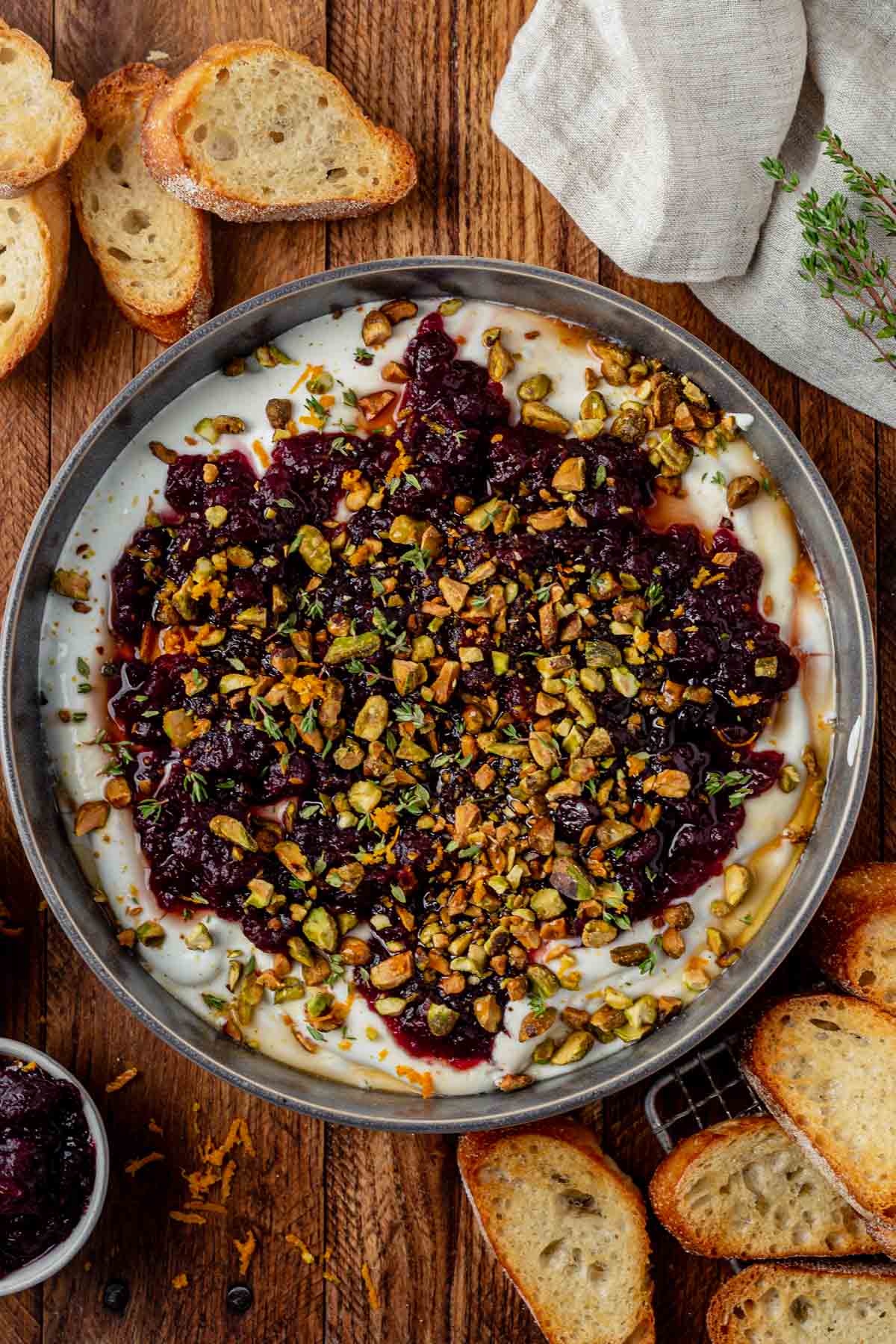 cranberry sauce on top of whipped feta with pistachios.