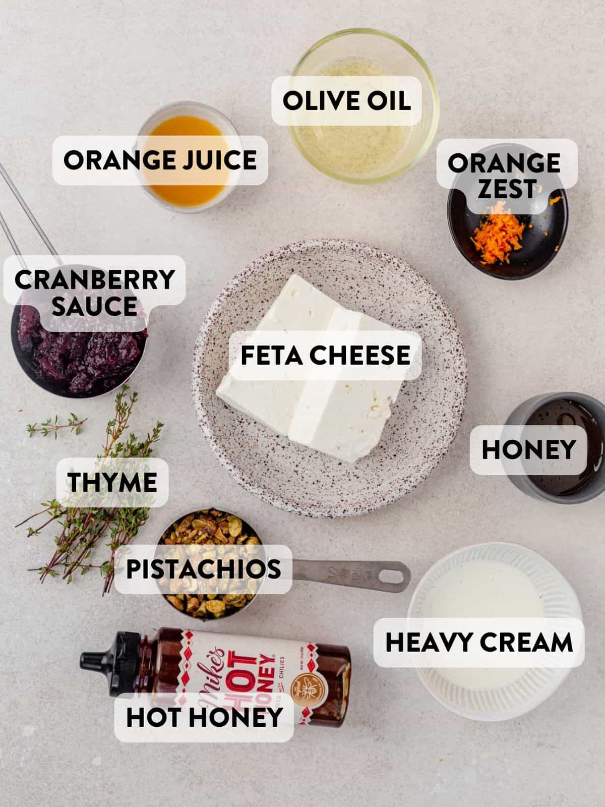 ingredients for cranberry whipped feta on a counter top.