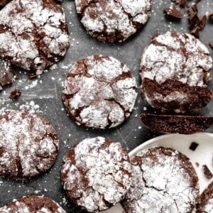 gluten free chocolate crinkle cookies on a countertop.