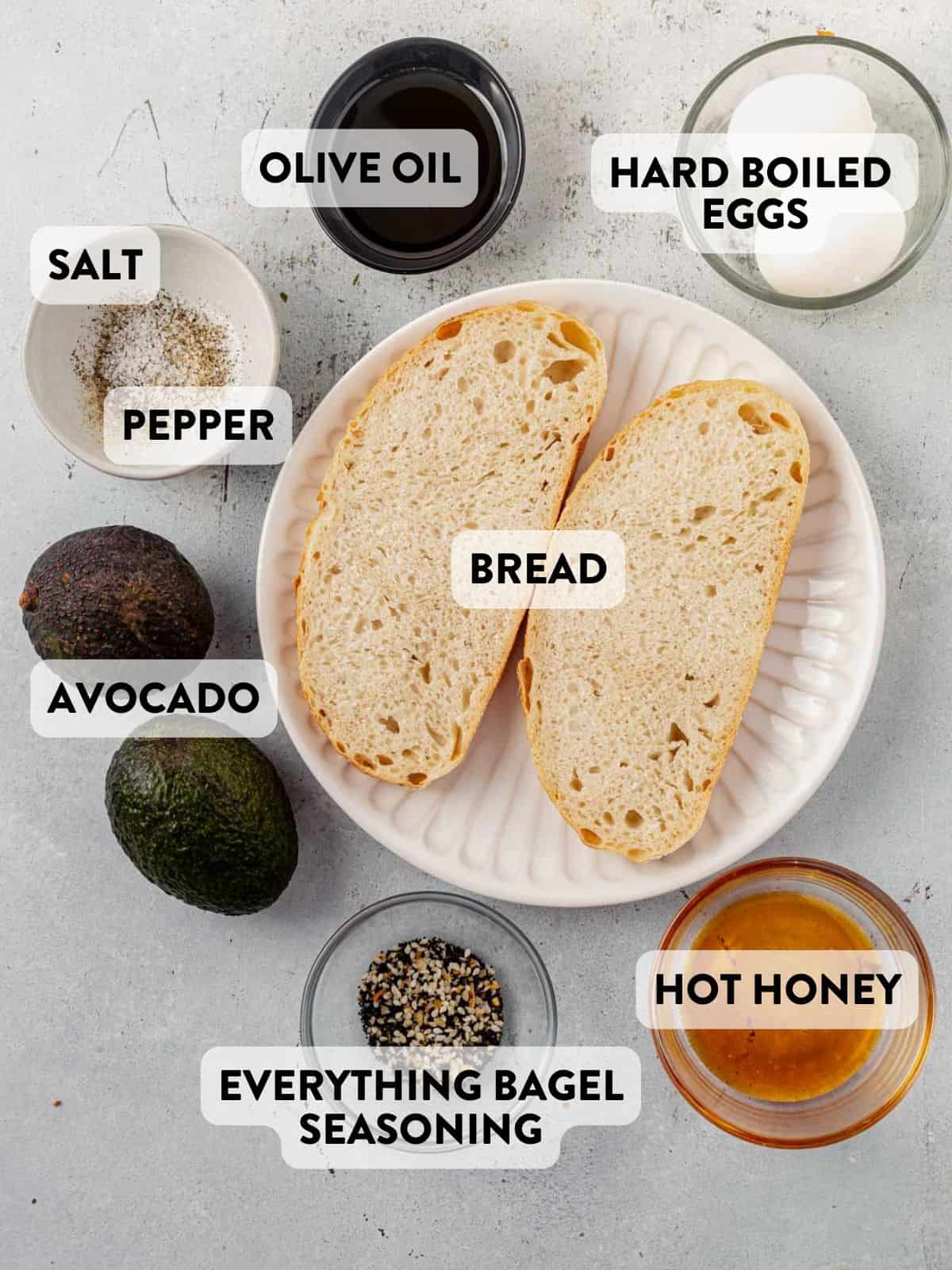 ingredients for avocado egg toast on a countertop.