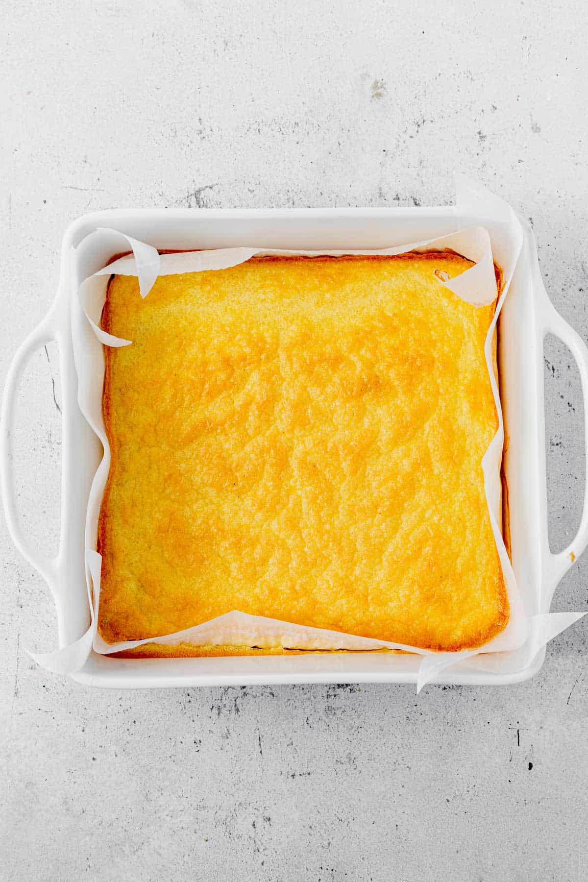 baked eggs in a baking dish with parchment paper.