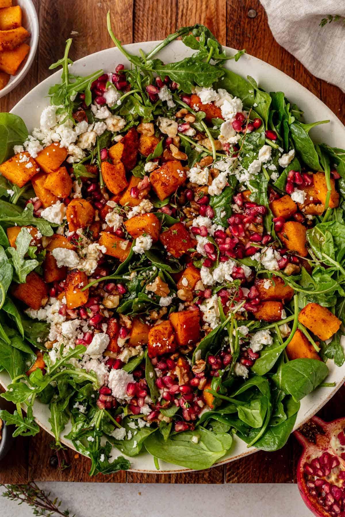 pumpkin feta salad with pomegranate, walnuts, and vinaigrette.