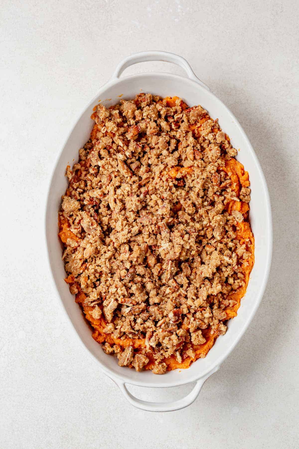 sweet potato casserole with streusel topping before being baked.