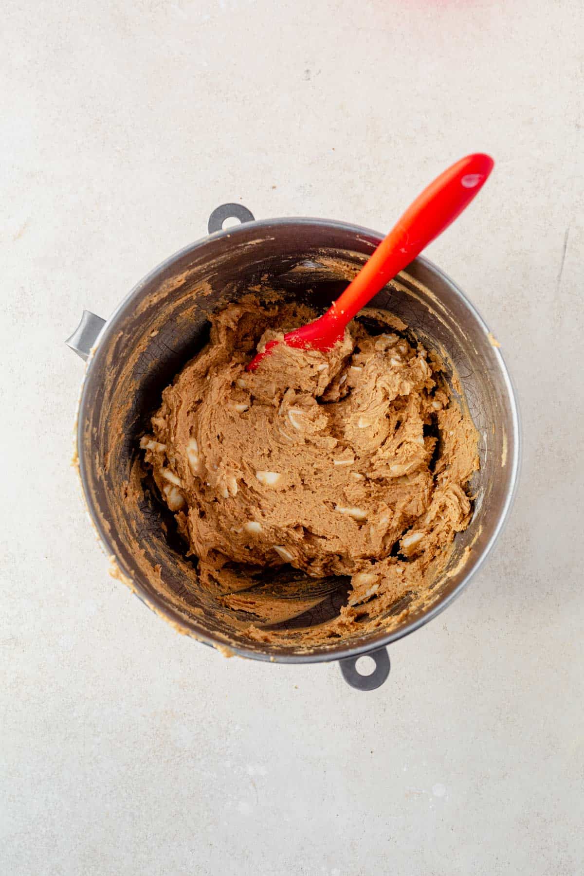 biscoff cookie butter cookie dough with white chocolate chips in a bowl.