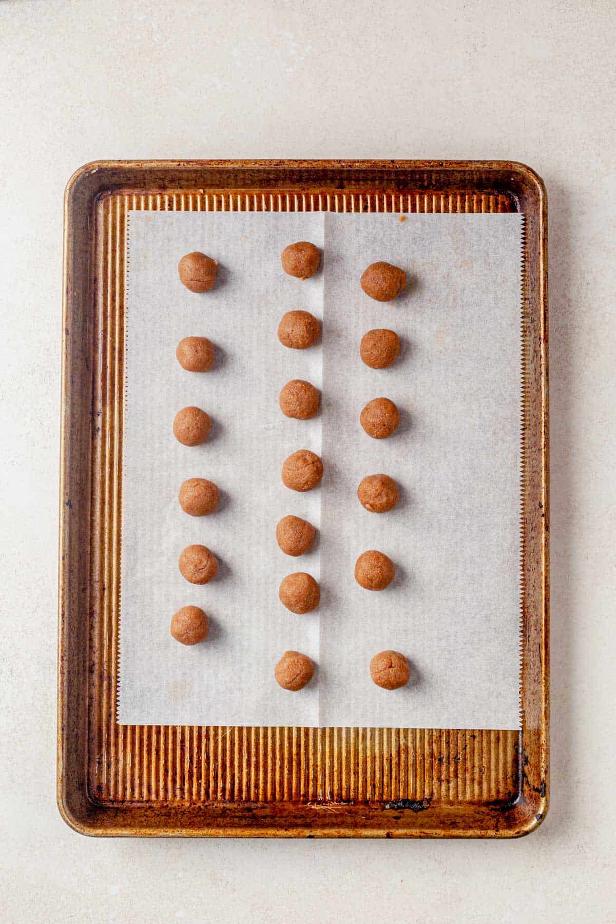 brown sugar pop tart filling rolled into balls and sitting on a cookie sheet.