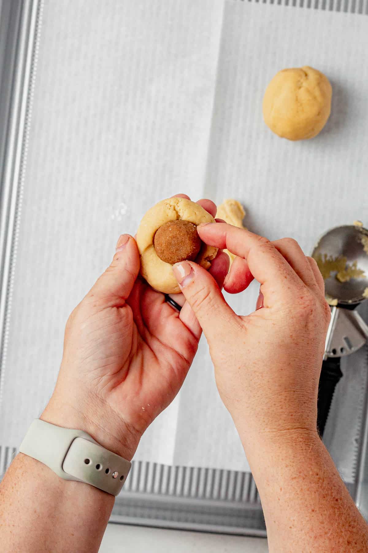 stuffing brown sugar filling inside a pop tart cookie.