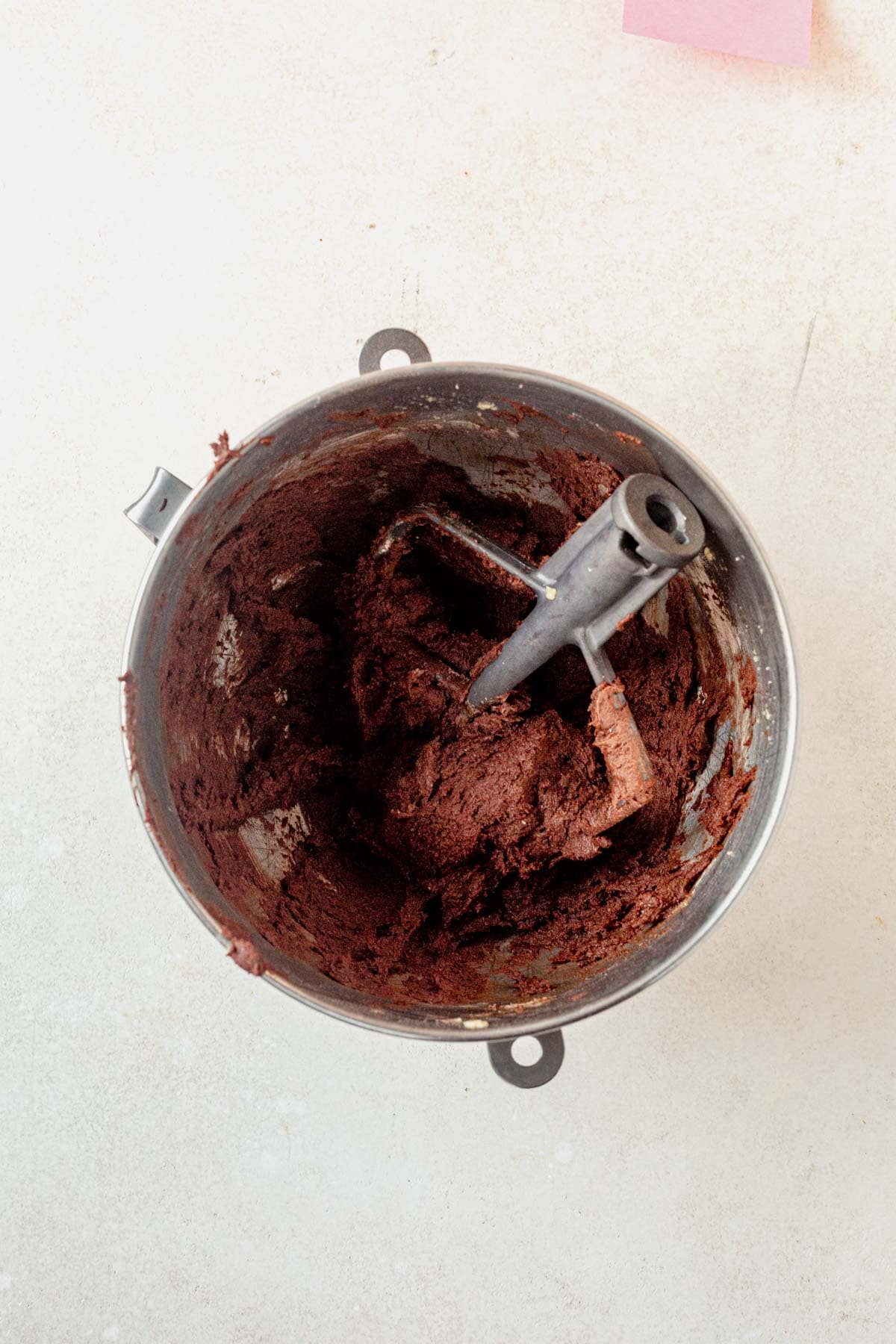 chocolate cookie dough in the bowl of a stand mixer.