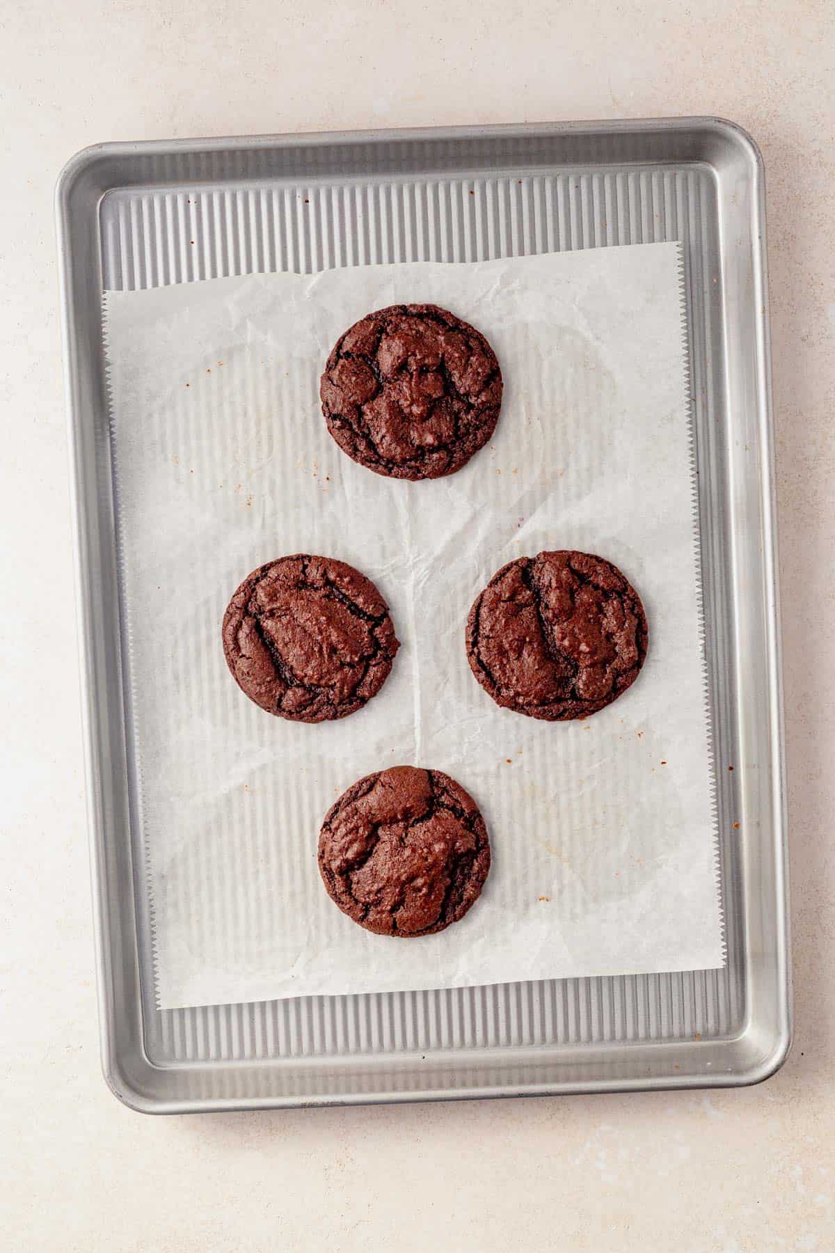 baked espresso martini cookies cooling on a baking sheet.