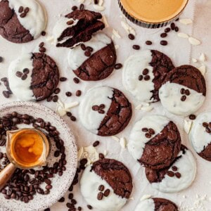 espresso martini cookies on a counter with an espresso martini and coffee beans.