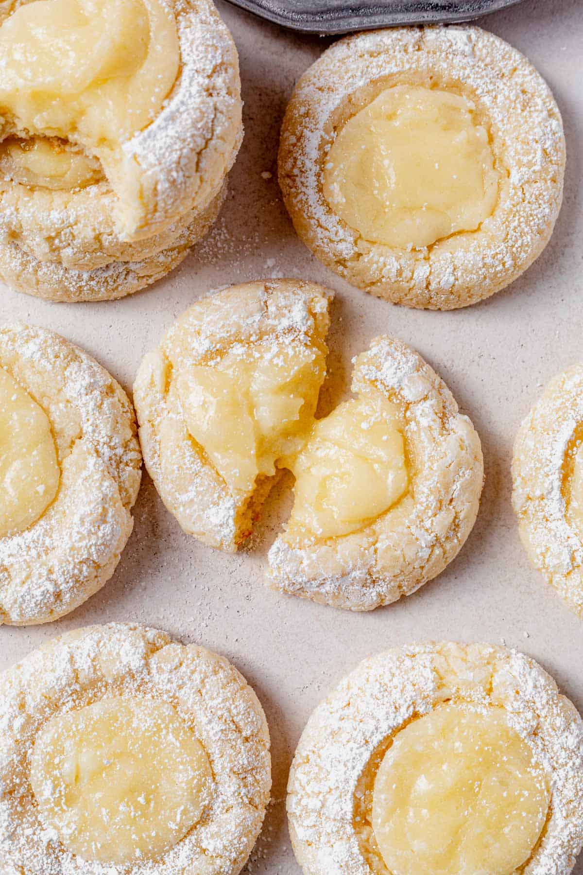 butter cake cookies on a countertop with one broken in half.