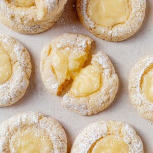 a gooey butter cake cookie broken in half.