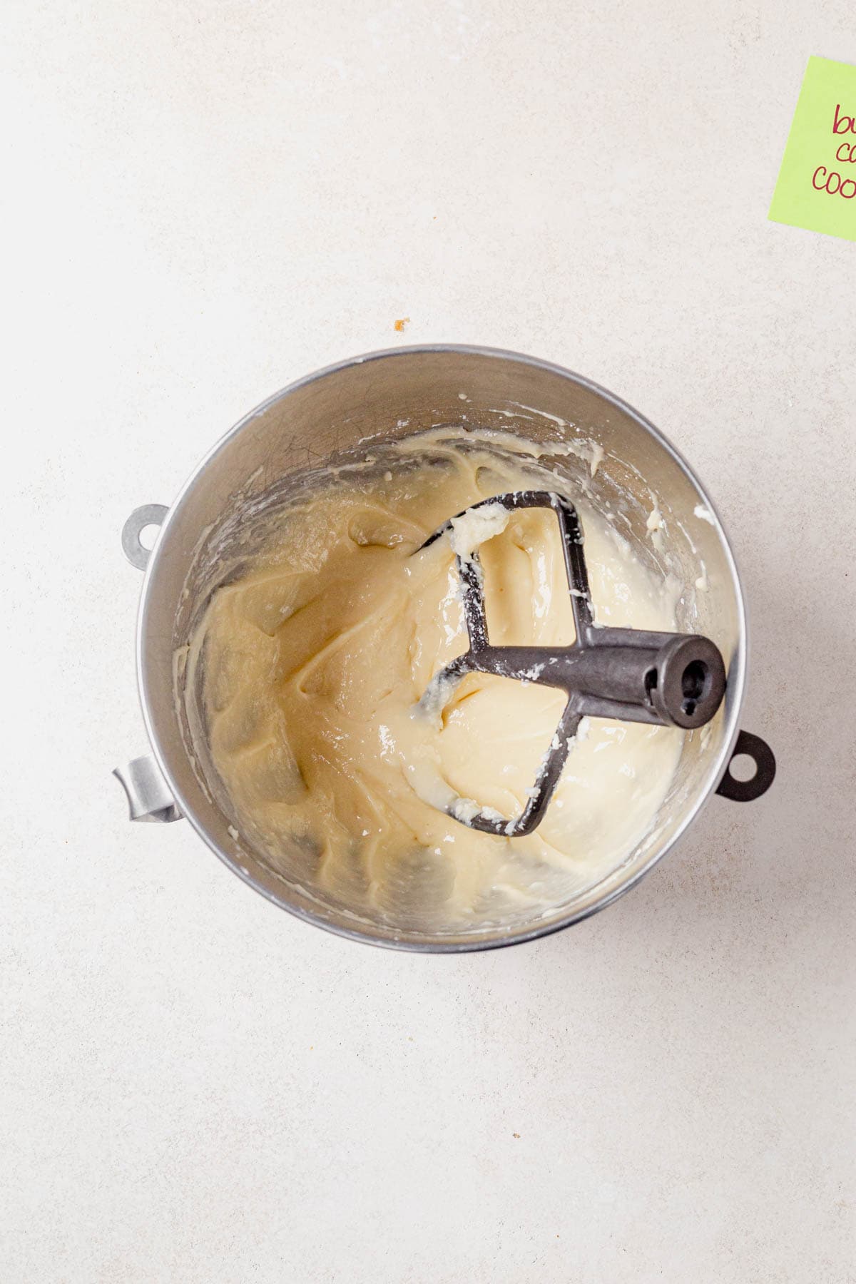 cream cheese butter filling for butter cake cookies in a mixing bowl.