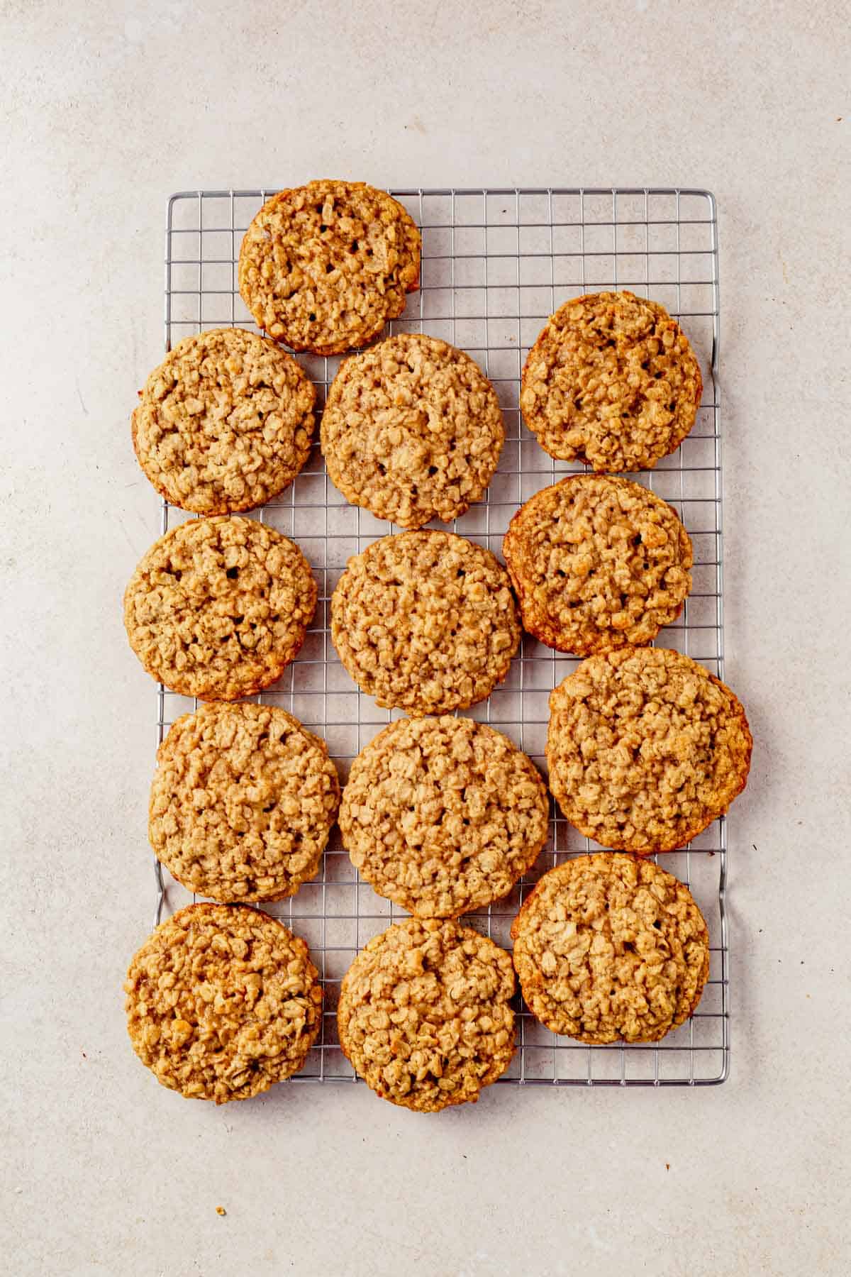 oatmeal cookies cooling on a wire rack.