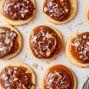 millionaire shortbread cookies decorated with gold leaf and sea salt.