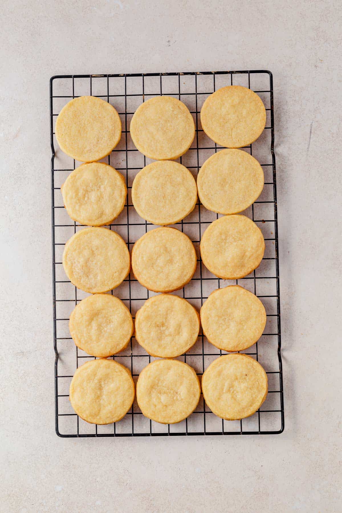 baked shortbread cookies cooling on a wire rack.