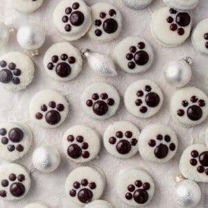 polar bear paw oreo cookies decorated with sanding sugar on a counter.