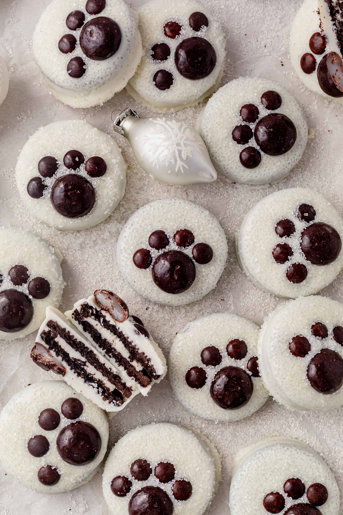 oreos covered in white chocolate and decorated like polar bear paws.