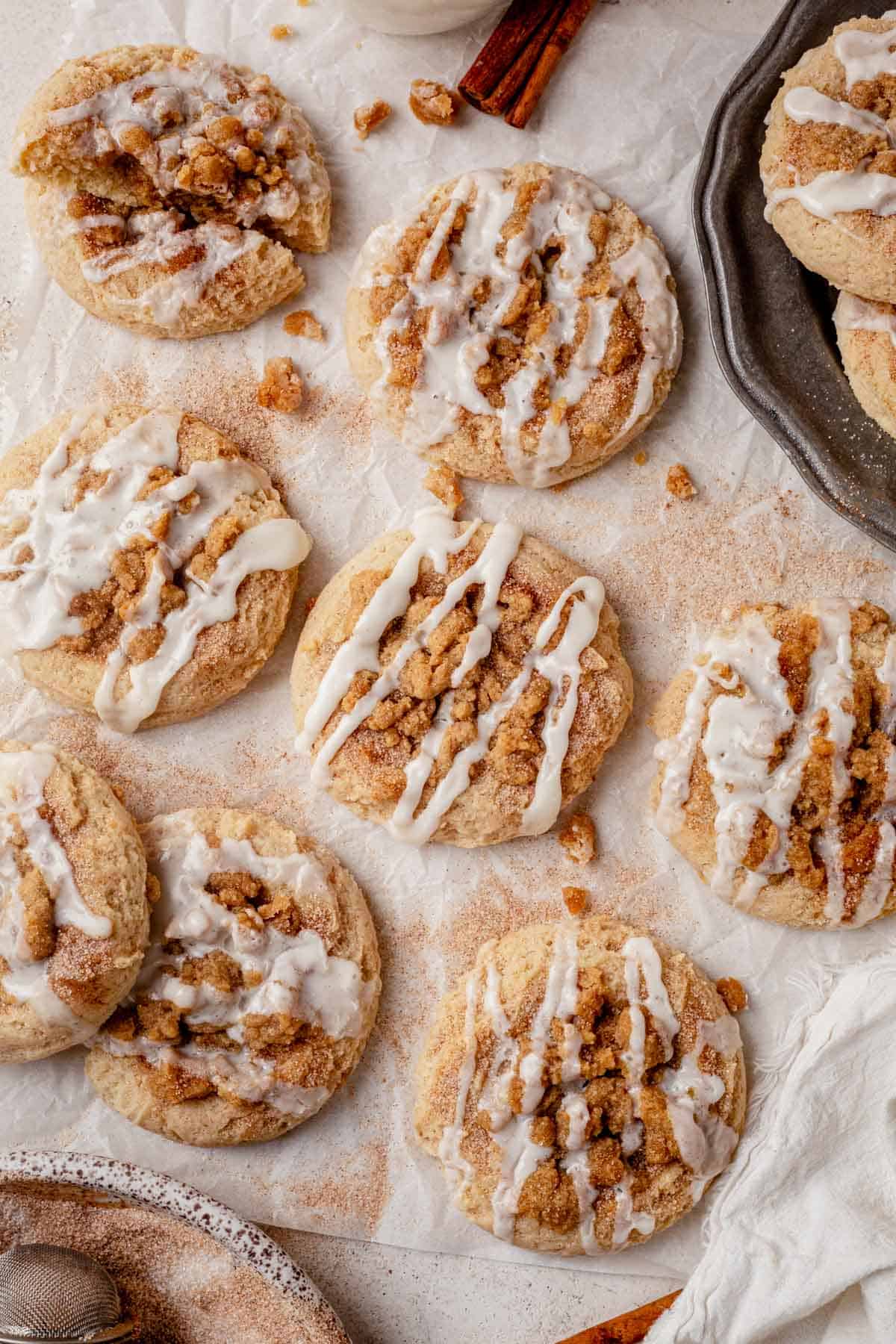 coffee cake cookies with icing on a piece of parchment paper.