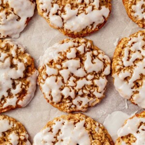 iced oatmeal cookies on a sheet pan.