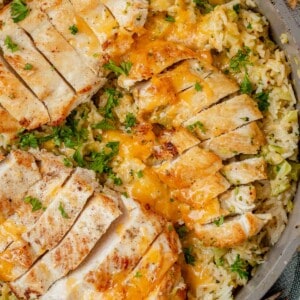 one pan cheesy chicken broccoli and rice in a skillet.