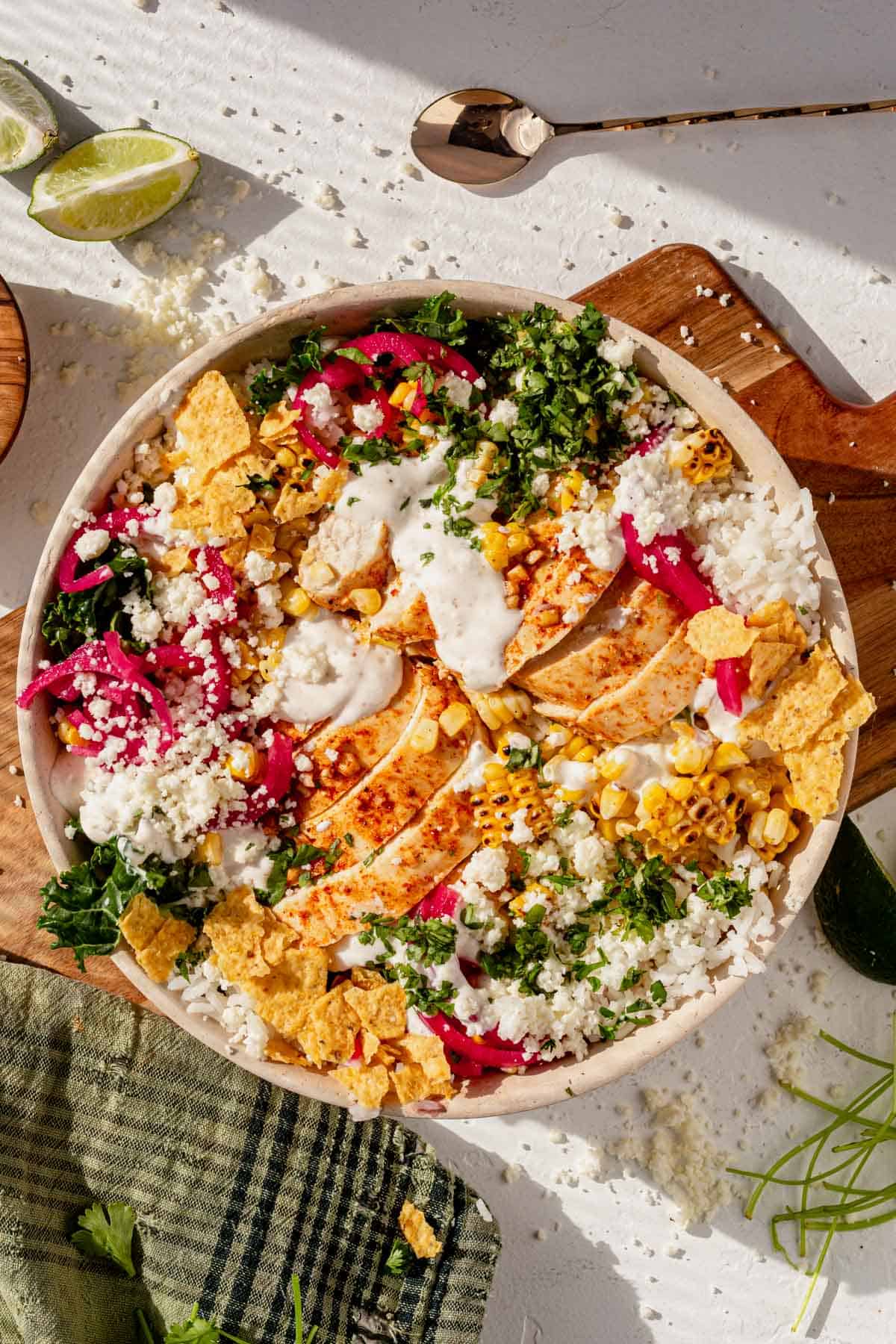 street corn chicken rice bowl on a counter.