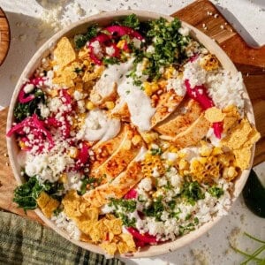 mexican street corn chicken rice bowl on a counter.