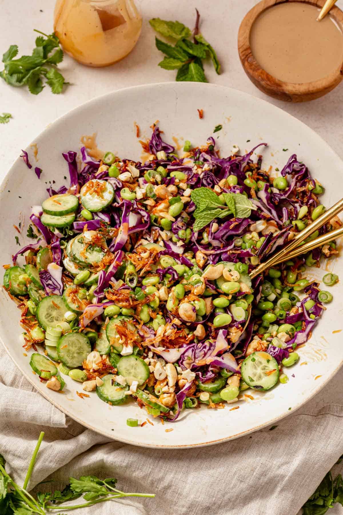 crispy rice salad mixed with dressing in a bowl.