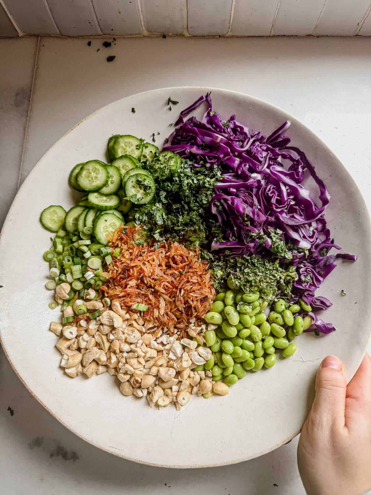 crispy rice salad ingredients in a large bowl.