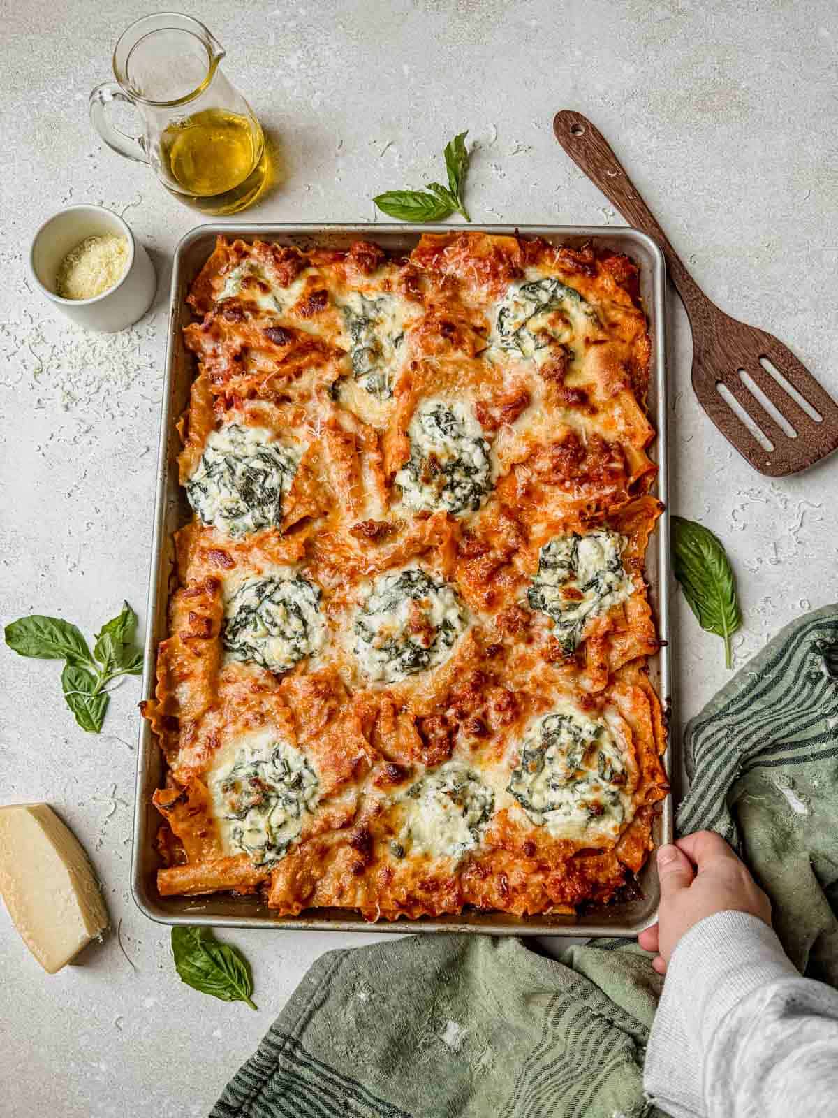 sheet pan lasagna with fresh basil.