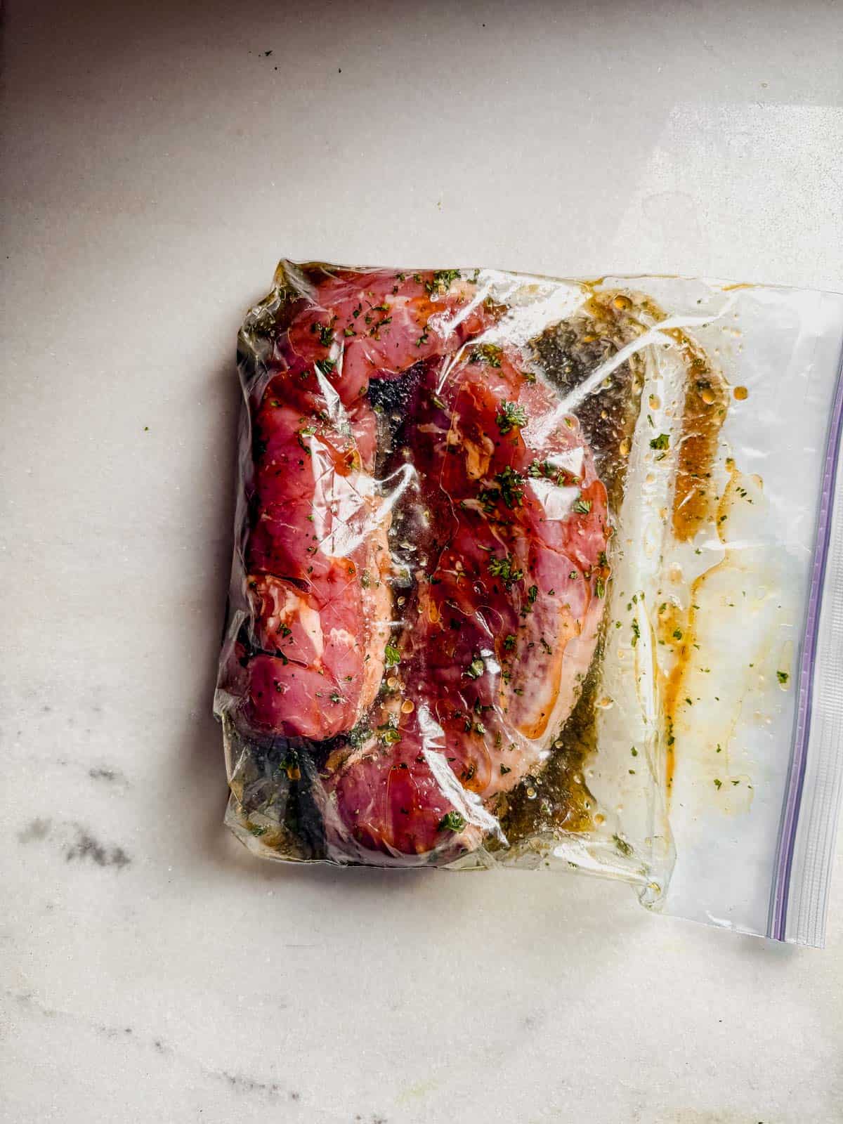 marinating pork tenderloin in a freezer bag.