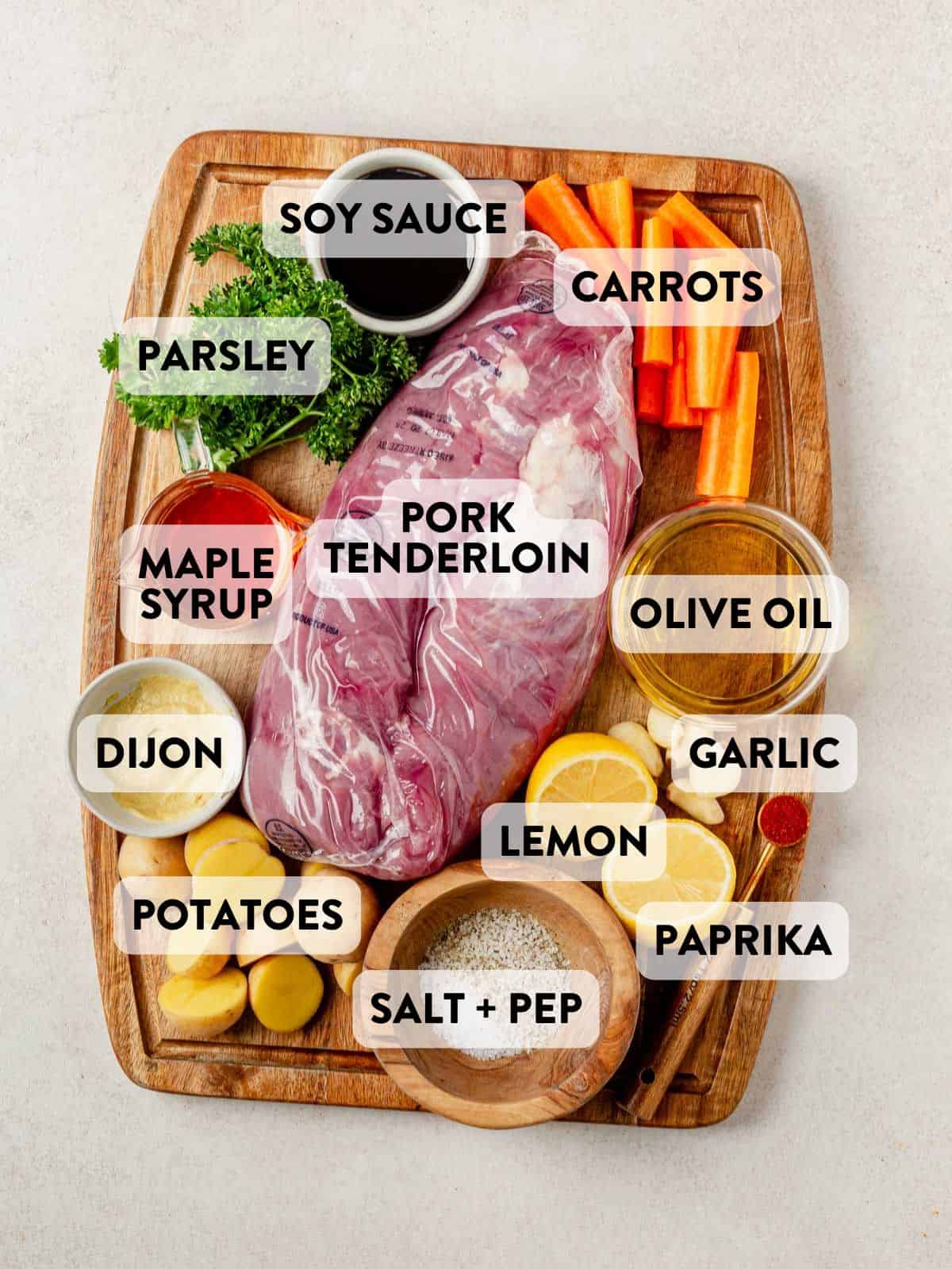 sheet pan pork tenderloin ingredients on a cutting board.