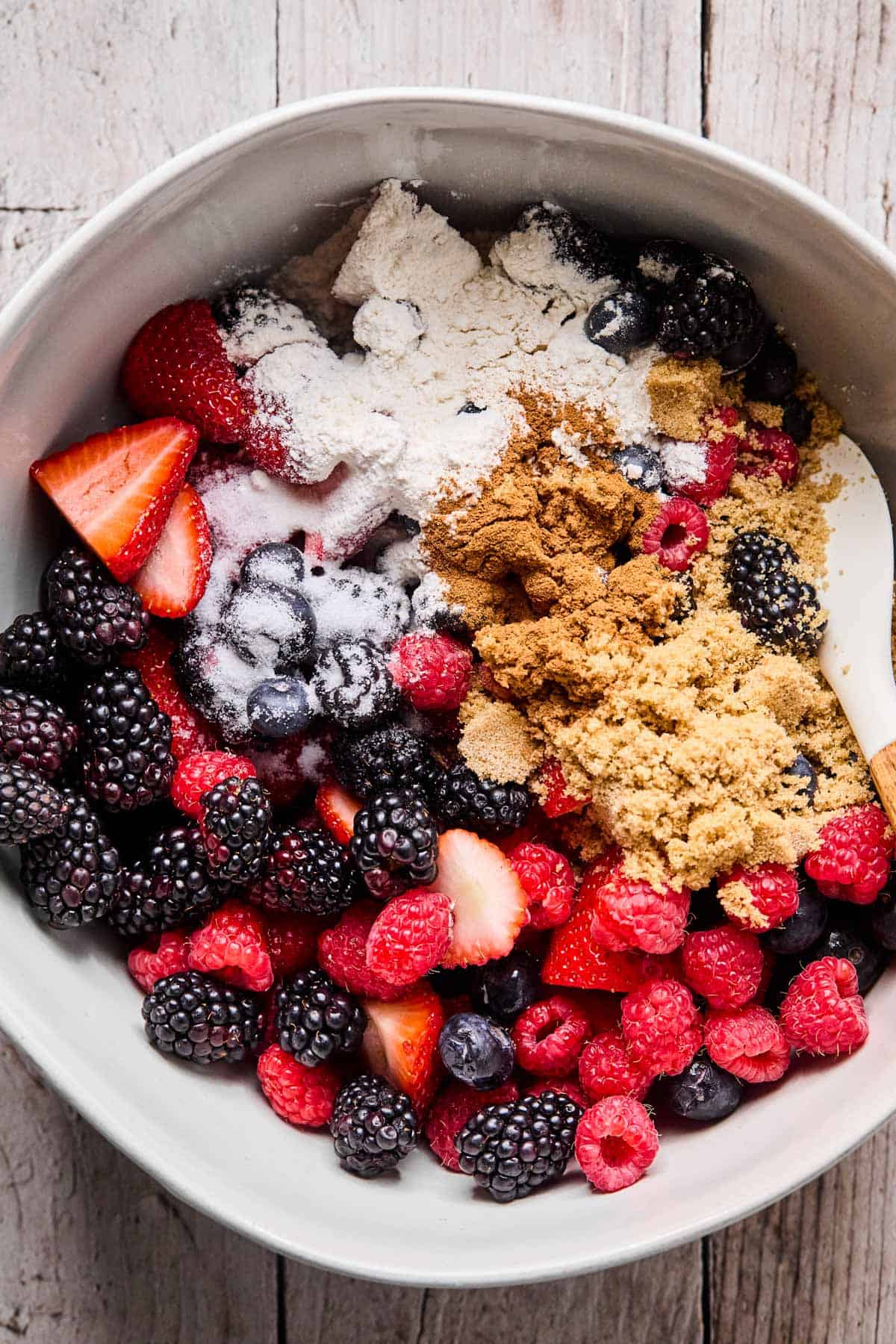 berries, salt, vanilla, brown sugar placed in a mixing bowl