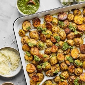 crispy pesto roasted potatoes on a sheet pan.