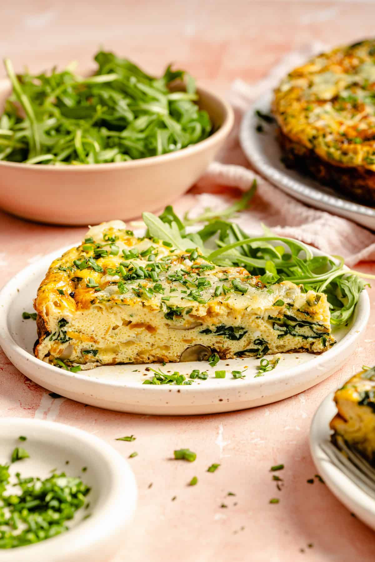 slice of vegetable frittata served on a plate