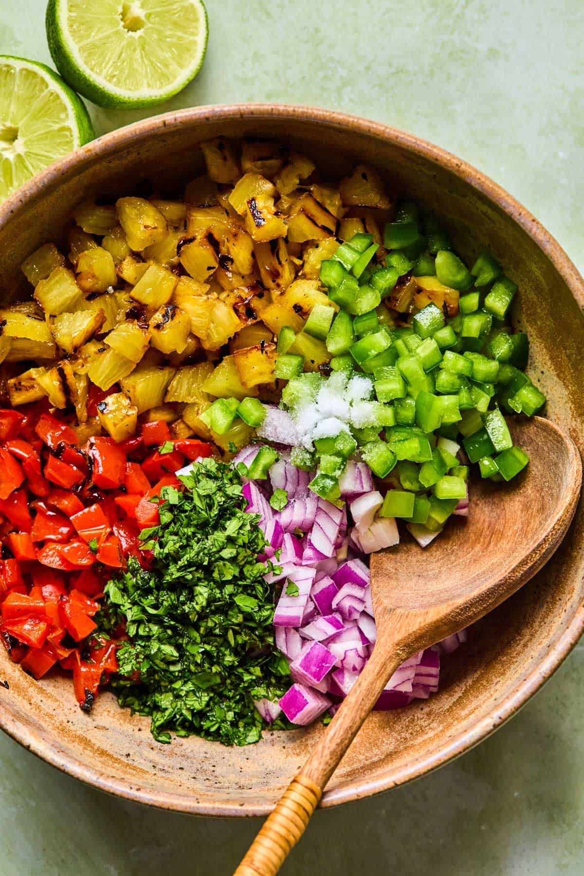 grilled pineapple salsa ingredients diced in a mixing bowl.