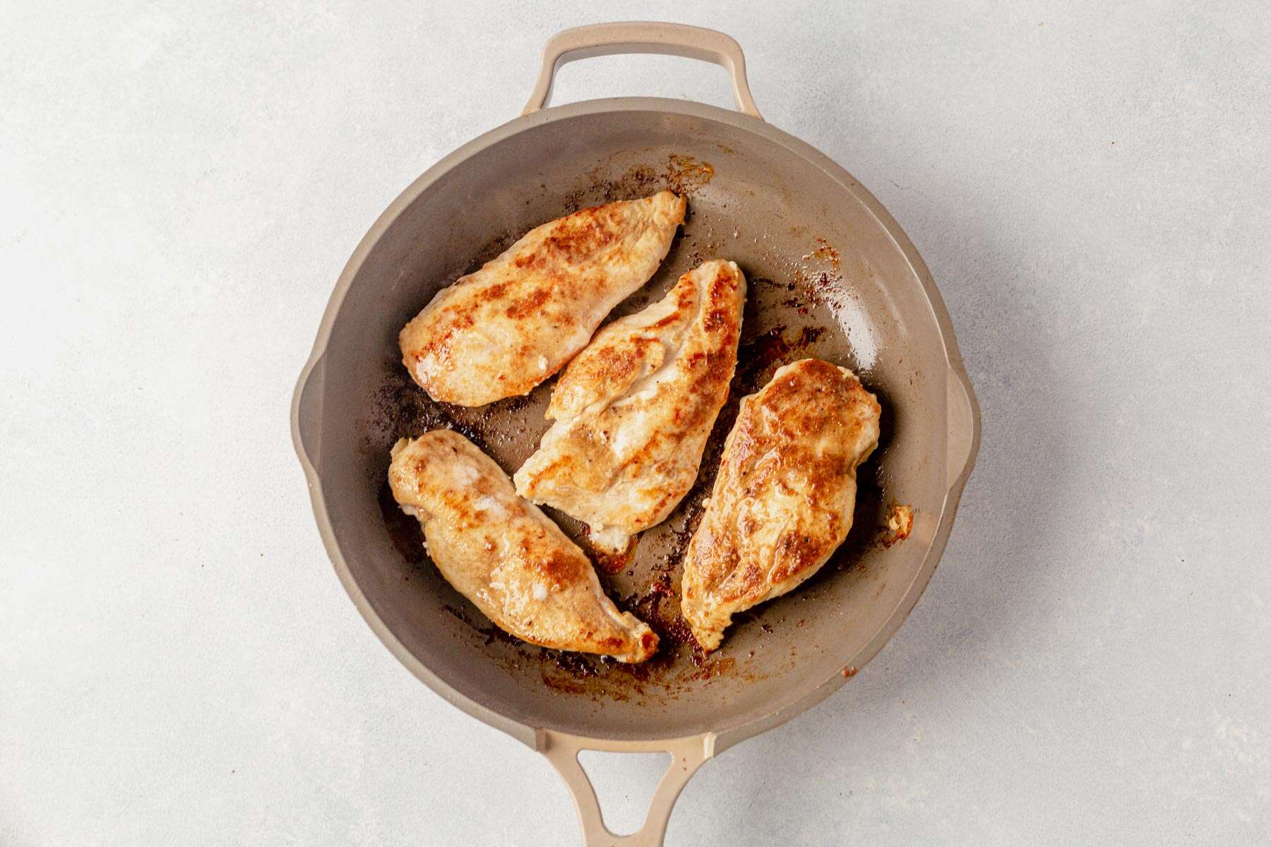 chicken breasts cooked in a nonstick pan