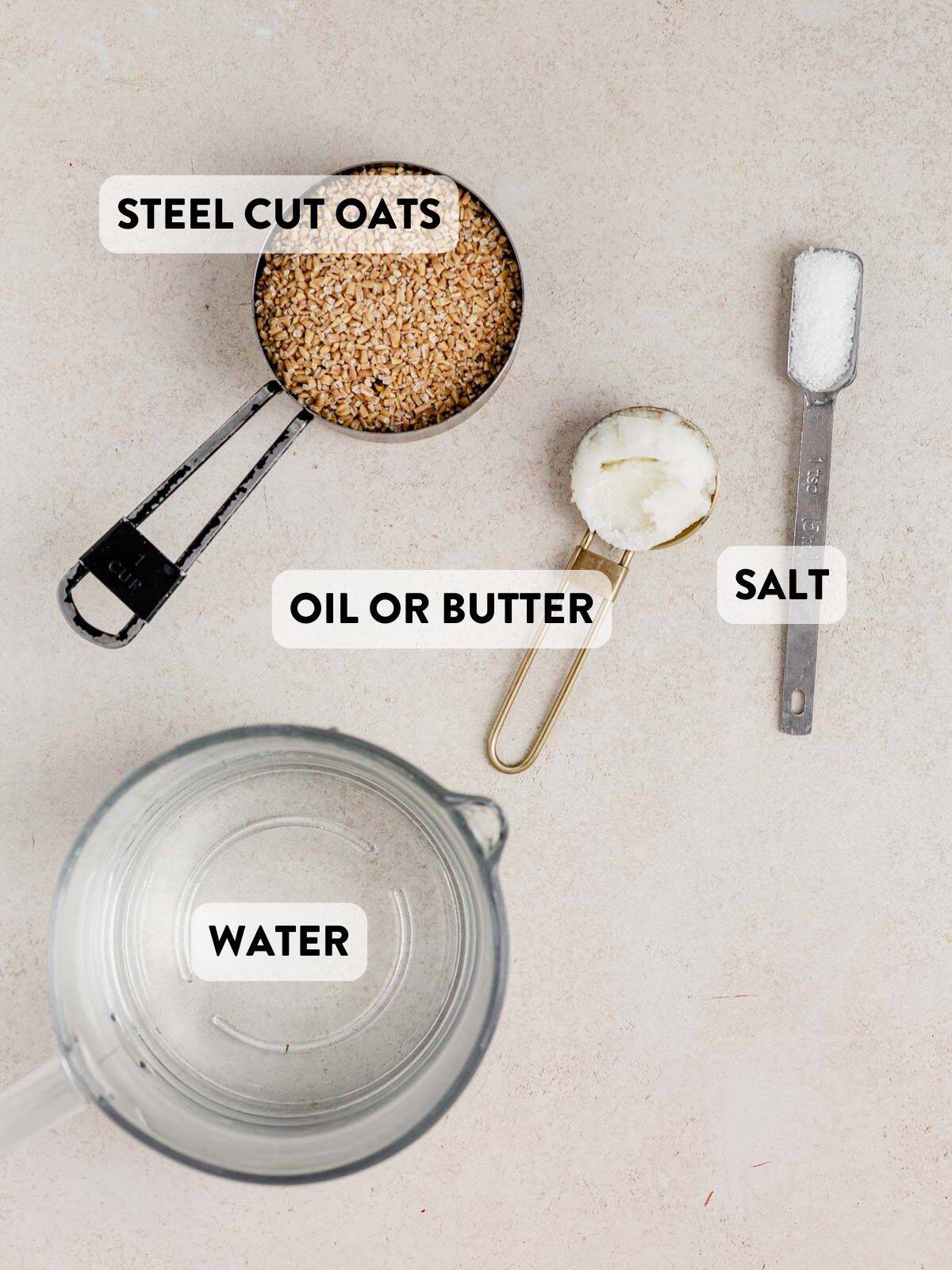 steel cut oats, coconut oil, salt, and water on a countertop.