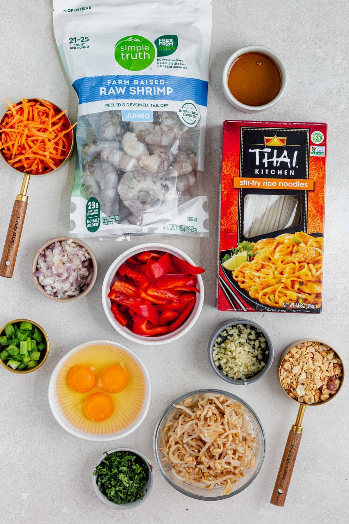 Shrimp pad thai ingredients on a counter.