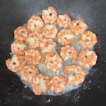 seared shrimp cooked in a wok.