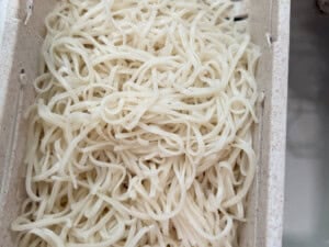 pad thai noodles strained in a collander.