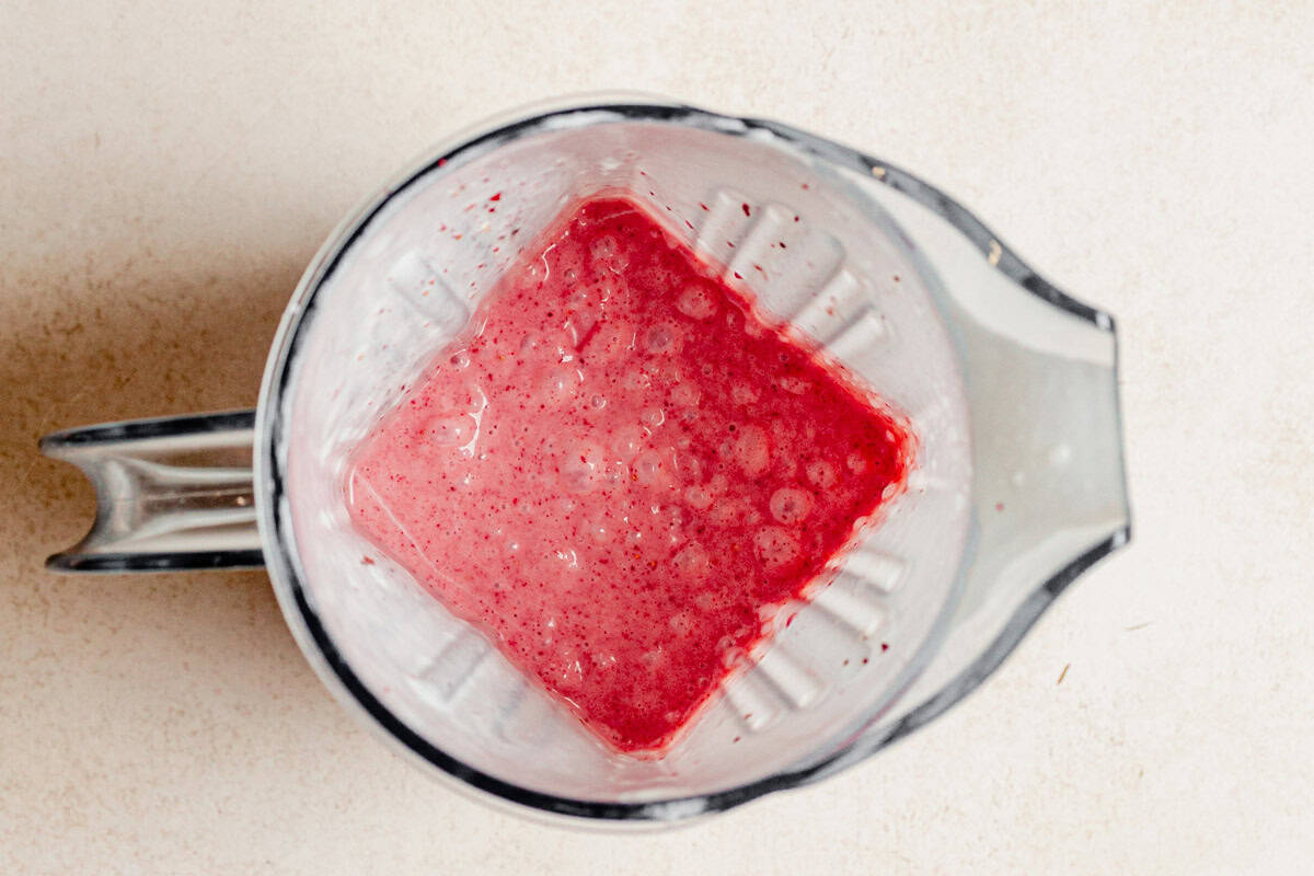 Cream, yogurt, strawberry jam, and freeze dried strawberries blended for strawberry shortcake ice cream bars.
