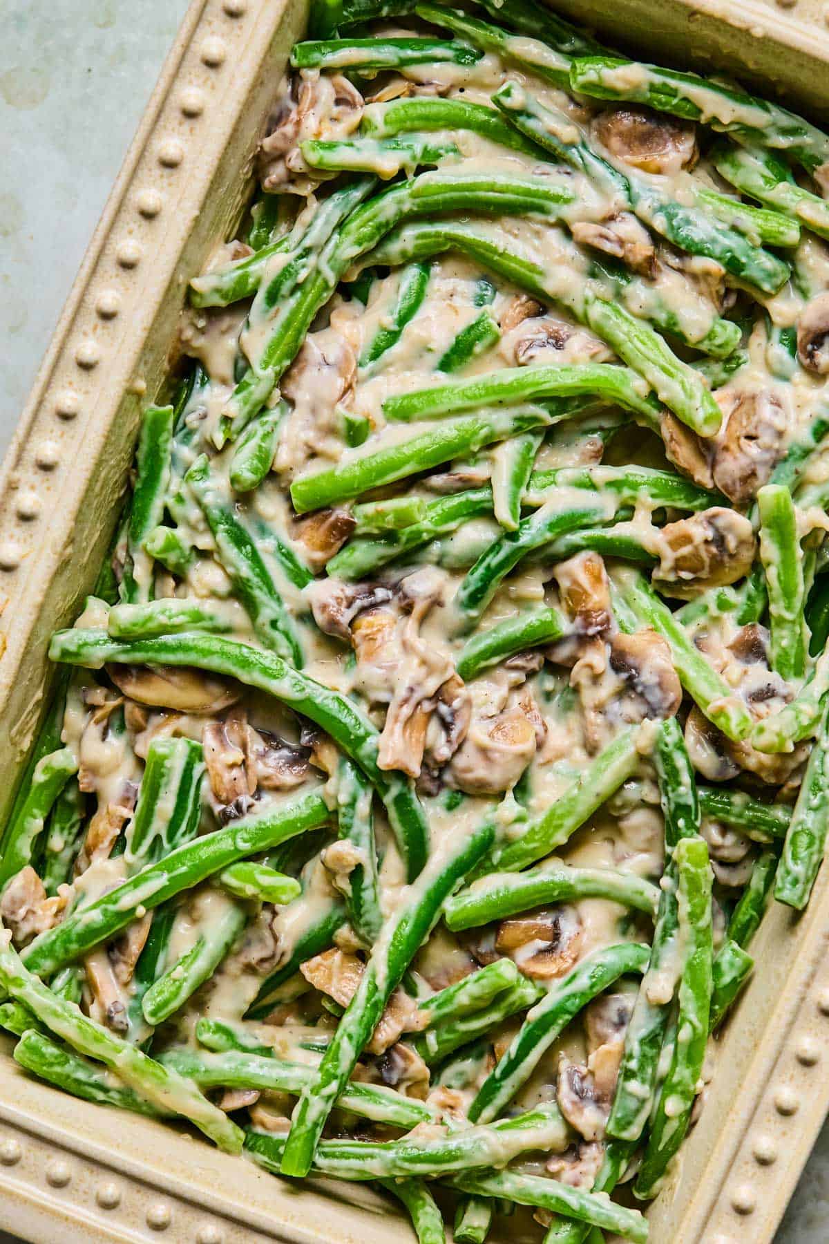 green beans added to the mushroom sauce for gluten-free dairy-free green bean casserole.