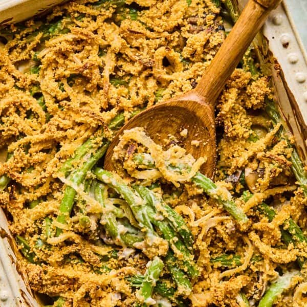 wooden spoon digging into gluten free dairy free green bean casserole