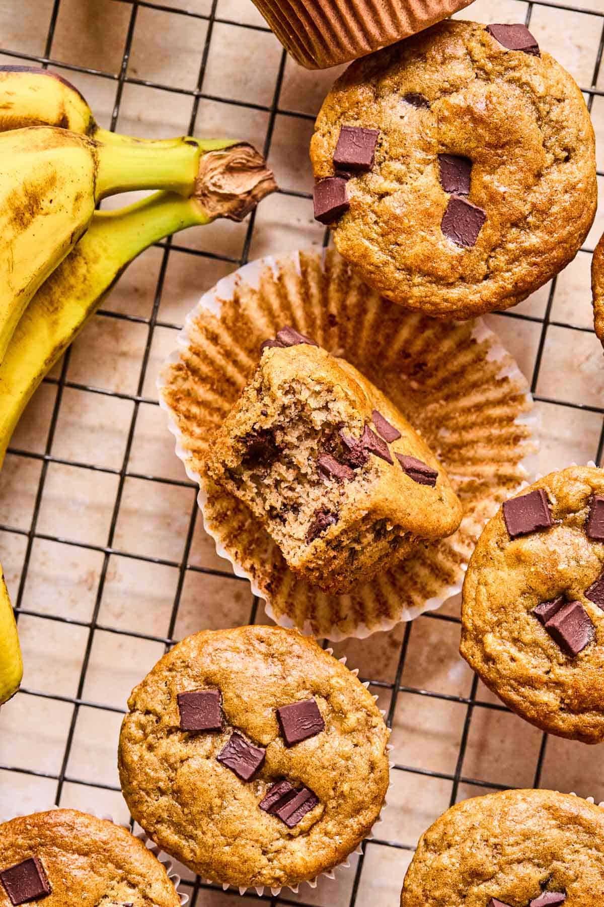 a batch of almond flour banana muffins on a cooling rack.