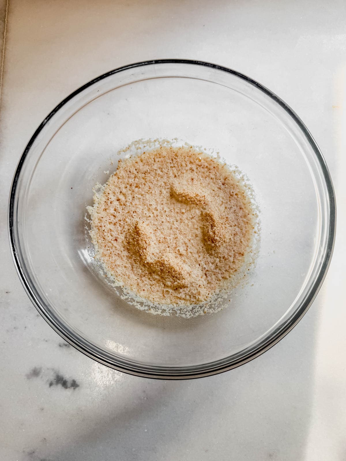 breadcrumbs soaking in a bowl of milk to make a panade for meatballs.