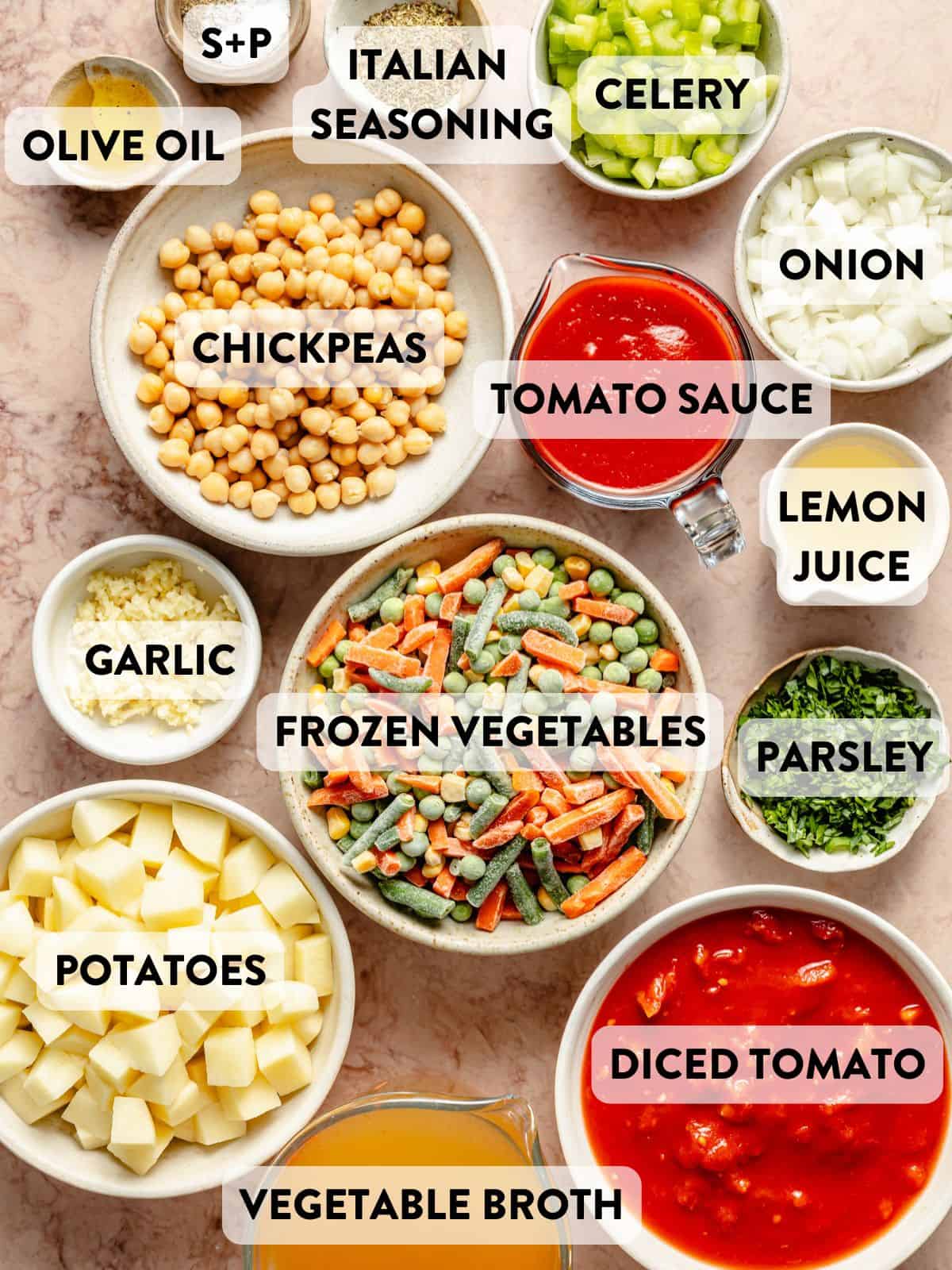 ingredients for easy vegetable soup laid out in bowls on a countertop.