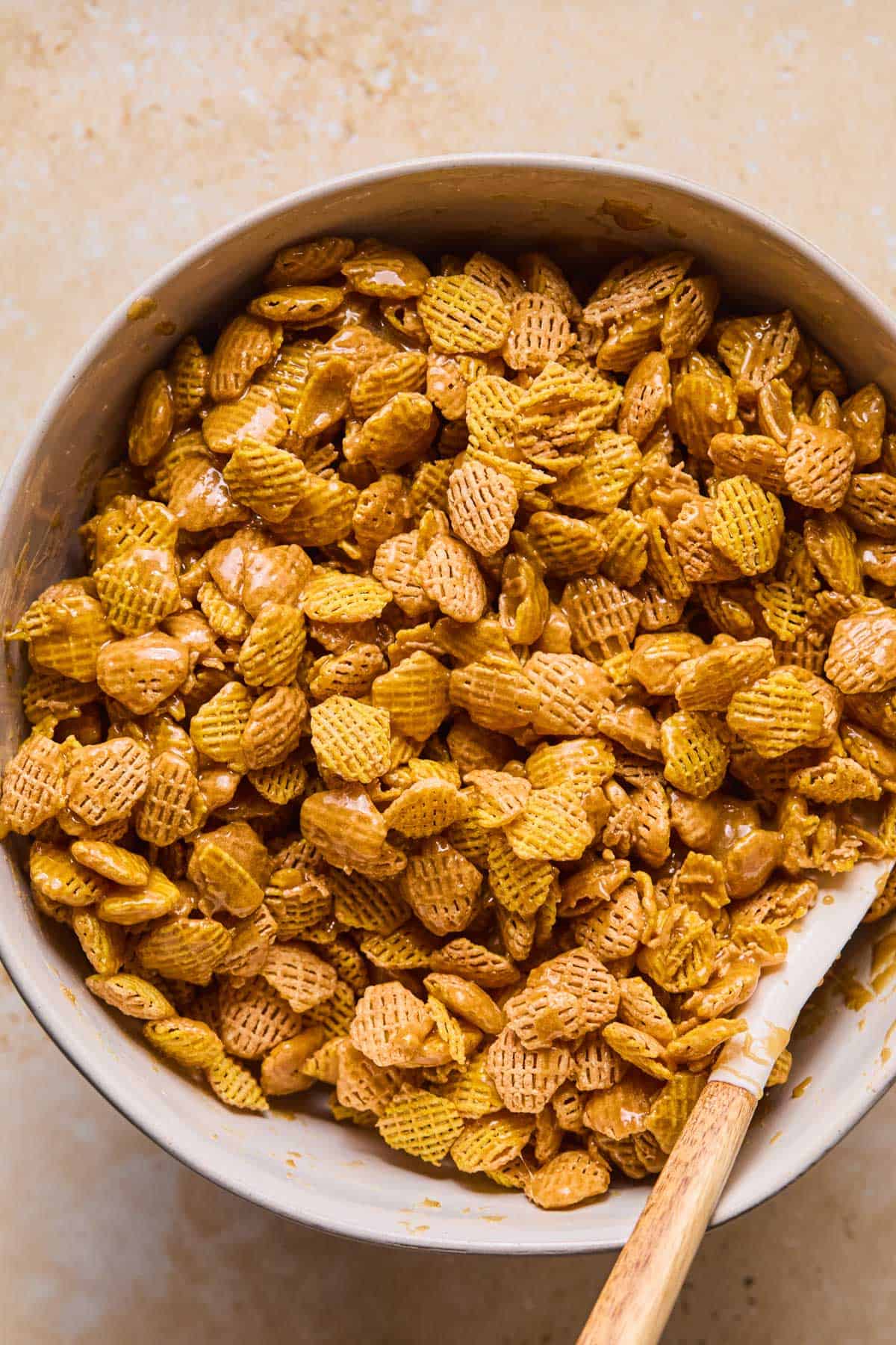 Bowl of caramel Crispix in a microwave safe bowl.